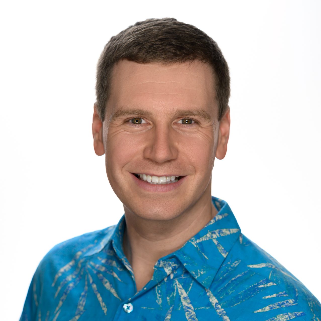 Male headshot on a pure white background.