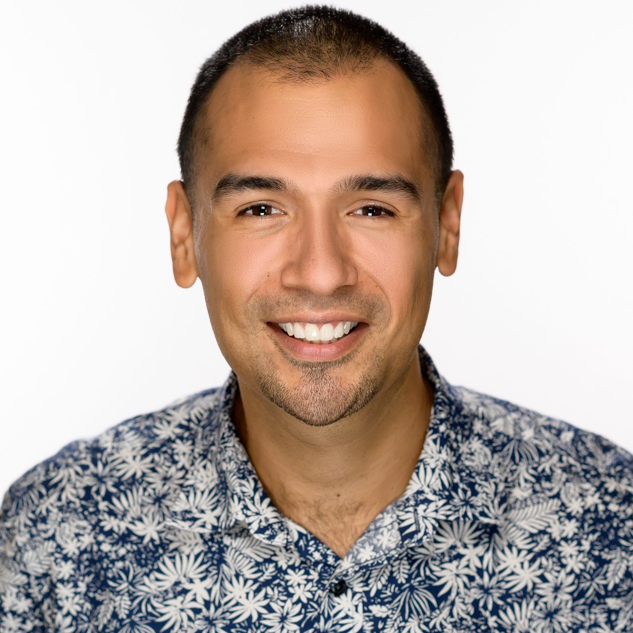 Male headshot on a pure white background.